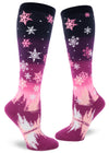 Pink gradient knee socks with pink and white snowflakes above falling on trees below.