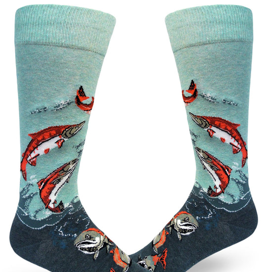 Blue and teal men's crew socks that feature bright orange and green salmon swimming and leaping in the air.