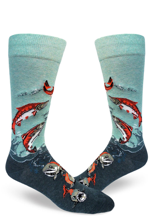 Blue and teal men's crew socks that feature bright orange and green salmon swimming and leaping in the air.