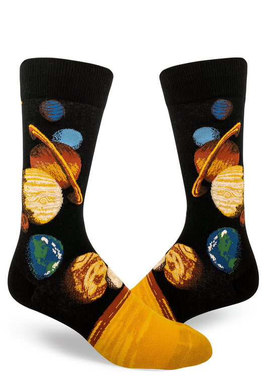 Black crew socks for men with a space design depicting all the planets of the solar system arranged in order in bright orange, yellow, green and blue.