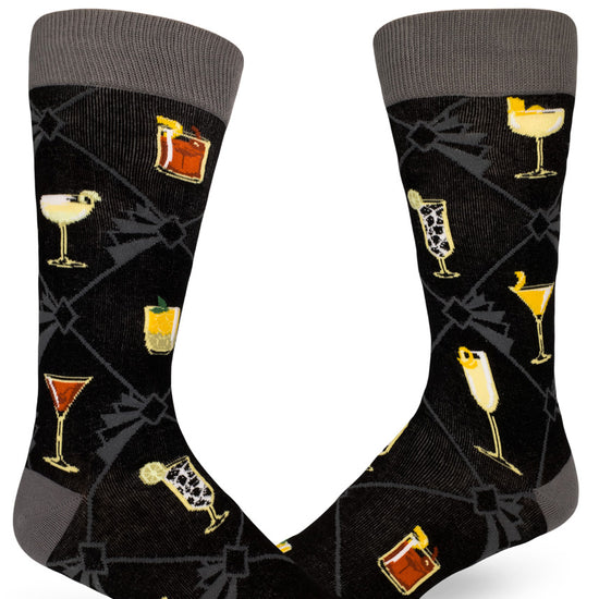 Black and gray crew socks for men with allover pattern of classic cocktails and art deco geometric lines.
