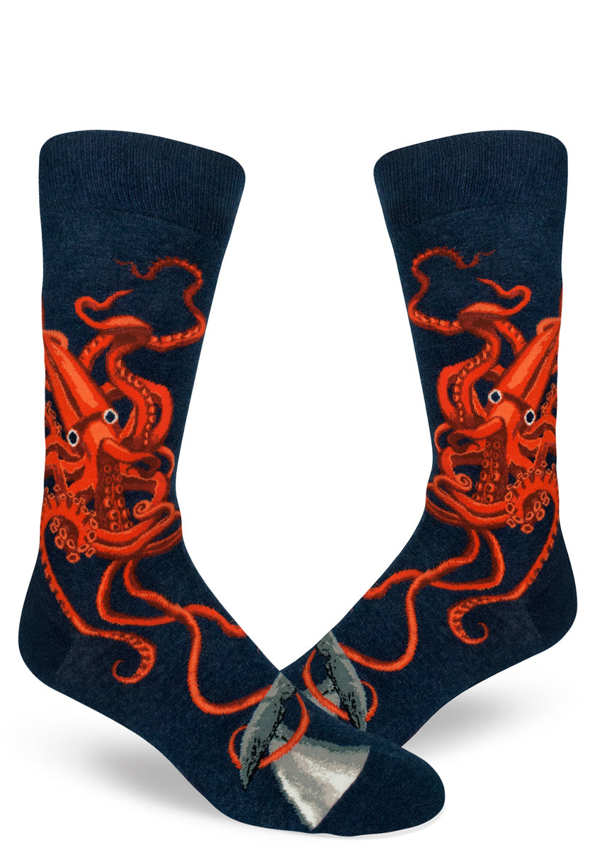 Navy blue men's crew socks featuring a bright orange giant squid design with tentacles twisting wildly.