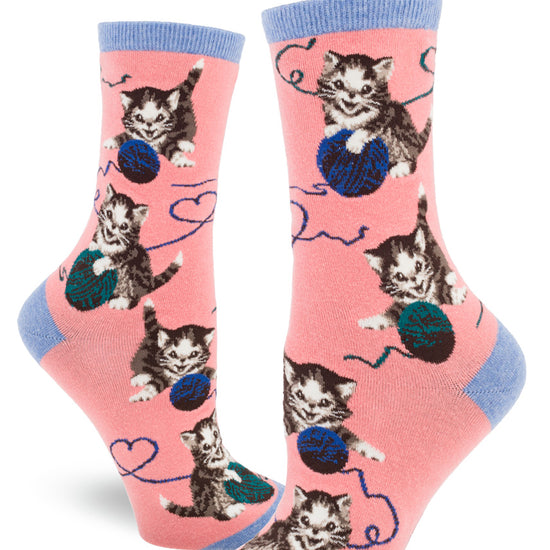 Bright pink women's crew socks with allover pattern of cute tabby kittens playing with balls of yarn.