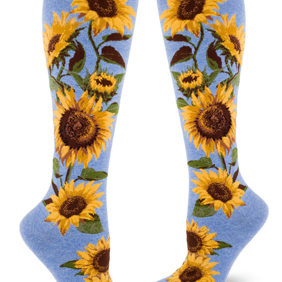 Light blue knee socks with large yellow and brown realistic sunflowers on the sides.