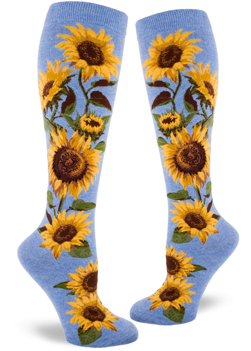 Light blue knee socks with large yellow and brown realistic sunflowers on the sides.
