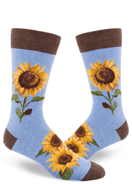 Men's sunflower crew socks in light blue with brown cuff featuring large yellow flowers with brown centers and green leaves.