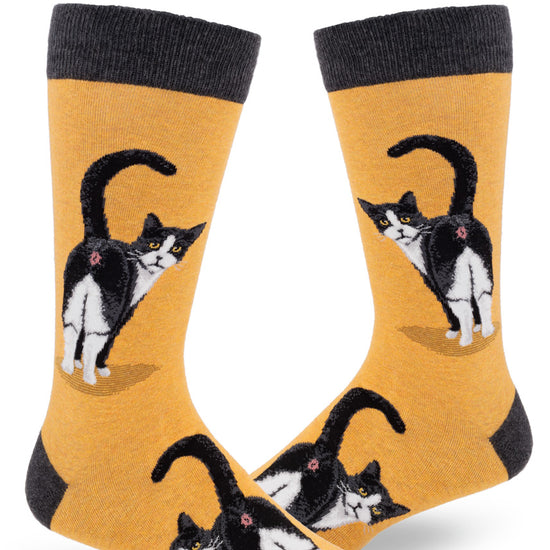 Yellow crew socks for men featuring a black and white cat showing its butt with its head turned back.