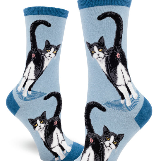 Light blue women's crew socks with black and white tuxedo cats showing their butts with their faces turned back.