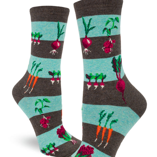 Striped crew socks for women in light blue and brown with a pattern of garden vegetables growing in the earth including carrots, beets, onions and more.