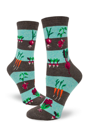 Striped crew socks for women in light blue and brown with a pattern of garden vegetables growing in the earth including carrots, beets, onions and more.