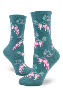 Women's crew socks with a teal background featuring a repeating pattern of pink bleeding heart flowers.